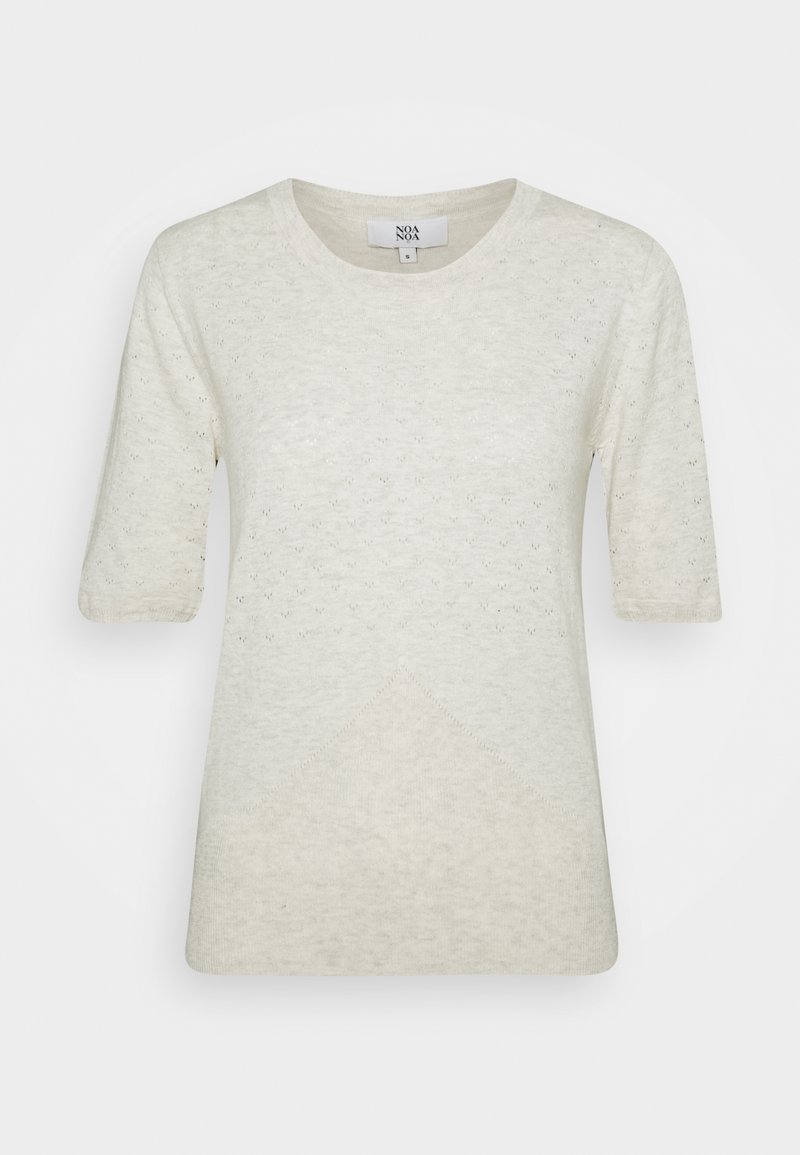 Haut court à manches courtes couleur crème avec un col rond, présentant un motif texturé et un détail en forme de losange en bas.