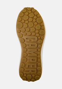 Camper shoe sole in brown rubber, featuring circular patterns, textured grip, and engraved "CAMPER" logo. Size indicator: 38.