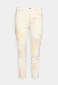 Džínsy světle žluté barvy s květinovým vzorem vyrobené z bavlny, se slim fit střihem, pěti kapsami a stříbrnými kovovými doplňky.