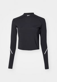 Musta pitkähiha ilmoittava paita, jossa on mock-neck-kaulus, valmistettu kevyestä materiaalista. Varusteena valkoiset yksityiskohdat hihoissa ja lyhennetty malli.