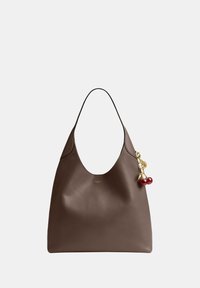 Brown leather shoulder bag with a single strap and attached gold-tone cherry charm on the side against a plain background.