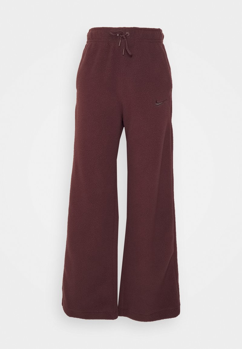 Pantalons de survêtement en polaire bordeaux avec une coupe large, une taille élastique, un cordon de serrage ajustable et un petit logo noir de Nike sur le côté.