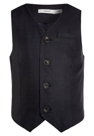 Ciemnoniebieska, bezrękawnik z dekoltem w kształcie litery V, pięcioma guzikami i małą kieszonką na piersi. Wykonana z teksturowanej tkaniny z gładkim wnętrzem.