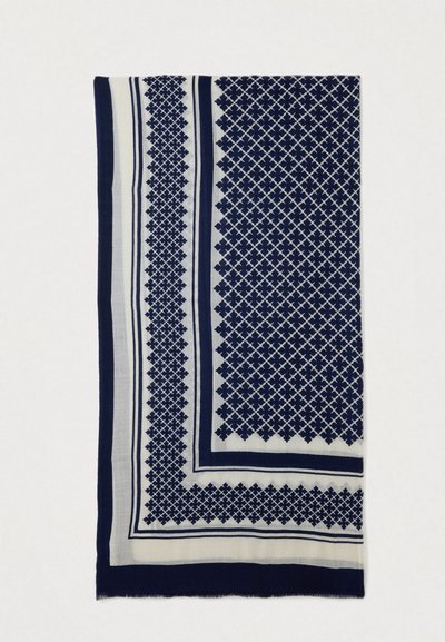 Écharpe bleu marine et blanche présentant des motifs géométriques, des bords effilochés et des bordures contrastées. Fabriquée en tissu léger au toucher doux.