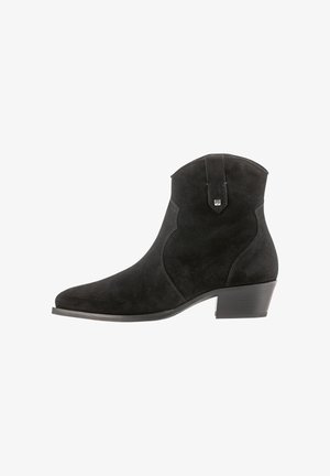 Black suede ankle boot with a pointed toe, curved side seams, and a low heel. Features a pull tab on the back for easy wear.