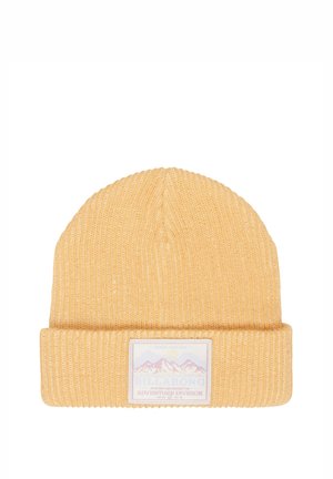 Yellow ribbed knit beanie with folded cuff and rectangular patch showing mountains and branded text.