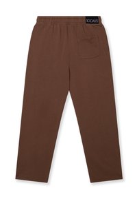 Bruine joggingsbroek met een elastische tailleband, zijzakken en een enkele achterzak. Gemaakt van een zachte, ademende stof.