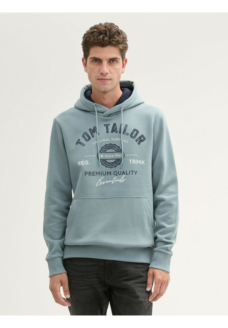 Felpa leggera blu con tasca a canguro, cappuccio con coulisse e fodera blu navy. Presenta testo grafico anteriore e polsini e orlo a coste.
