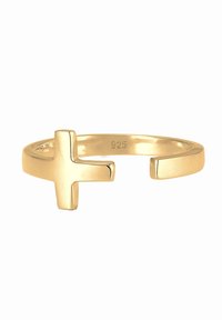 Anello in tono oro con un design aperto che presenta un accentuato motivo a croce. Realizzato in metallo, contrassegnato con "925" per argento sterlino. Finitura liscia.