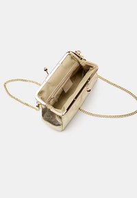 Bata Vakarsomiņa - gold coloured