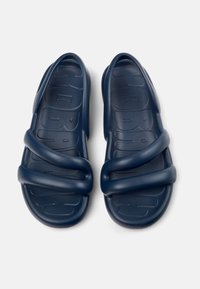 Navy blue molded sandals with two thick straps, textured footbed for grip, and contoured shape for comfort. Made from durable rubber material.