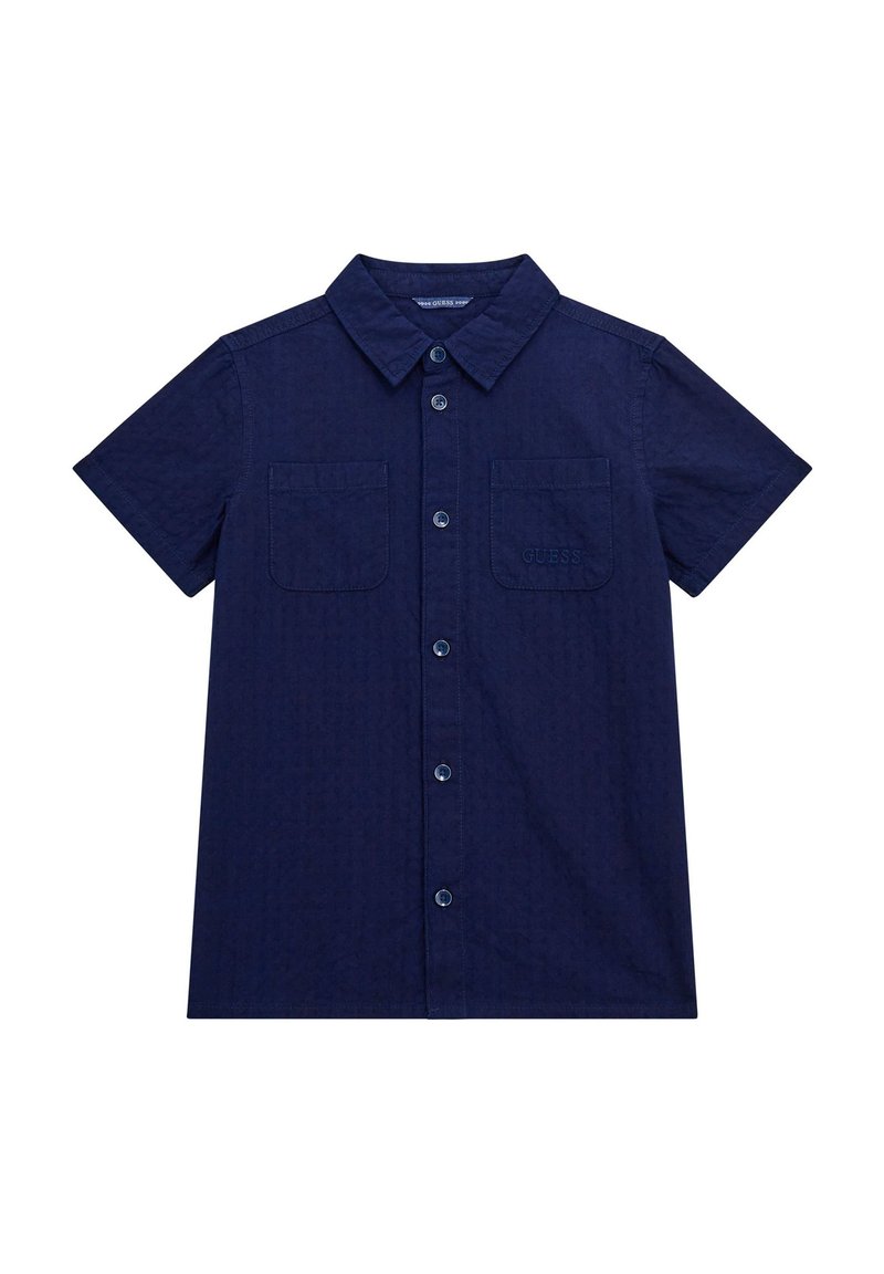 Marineblauwe korte mouwen knoopshirt gemaakt van gestructureerde stof. Voorzien van twee voorzakken en een geborduurd logo op de linkervzak.