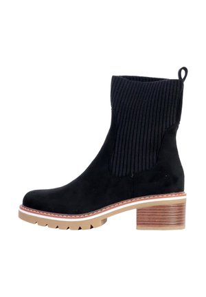 Bottine en suede noir avec tige en tissu côtelé, bout rond et talon empilé en bois brun. Comprend une semelle épaisse et rembourrée pour un confort accru.