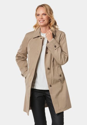 Beige trenchcoat met een klassiek ontwerp, voorzien van een knoopsluiting, twee zijzakken en een kraag. Glad stof en perfecte pasvorm.