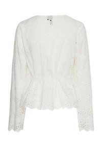 Blouse peplum blanche en tissu broderie anglaise, dotée de manches longues, d'un ourlet festonné et d'une fermeture à boutons au dos.