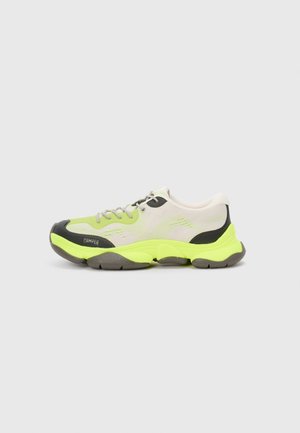 Sport sneaker featuring a breathable light gray mesh upper with neon green accents, black rubber toe cap, and chunky gray outsole.