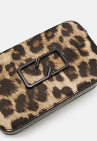 Leopard print wallet with a textured surface, featuring a black rectangular hardware accent and black edges. Compact rectangular shape.