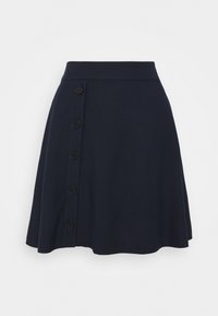 Marinblå kjol med en utställd design, som har en slät yta och sex svarta knappar längs sidan. Elastisk midja för komfort.