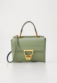 Green leather handbag with a structured shape. Features a top handle, detachable strap, and a gold clasp closure. Textured finish.