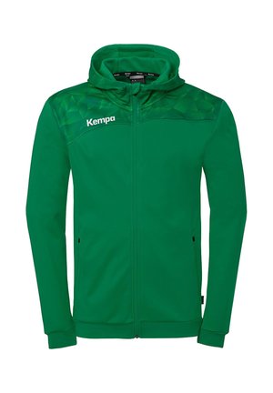 Grøn hættejakke med lynlås, geometrisk mønster på skuldrene og hvid "Kempa"-logo på venstre bryst.
