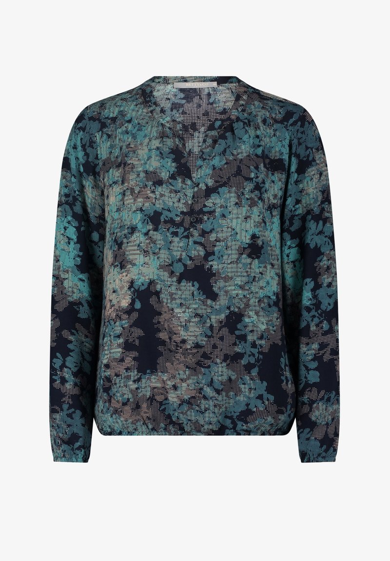Blouse à manches longues pour femmes avec un motif floral abstrait bleu et beige et un motif en quadrillage, encolure ronde et patte de boutonnage à l'avant.
