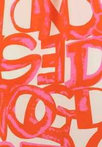 Bold patterned fabric featuring large, pink letters on an orange background. Smooth texture with a vibrant color contrast.