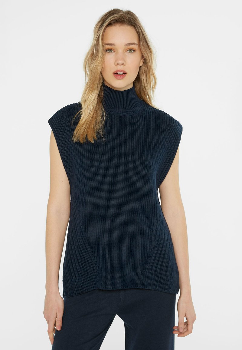 Marineblauer, gestrickter ärmelloser Rollkragenpullover mit einem strukturierten Muster, entspannter Passform und einem hohen Kragen sowie einem geraden Saum.