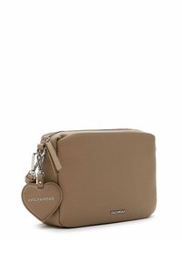 Tan leather clutch with a textured finish, featuring a silver zipper, a heart-shaped charm, and logo accents on the front.