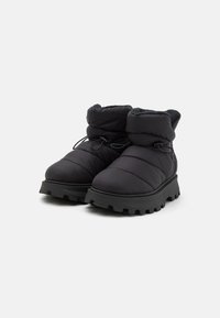 Black padded ankle boots with a soft interior, elastic drawstring, and textured rubber sole featuring deep treads for grip.