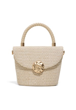Small beige woven handbag with braided handle and large round textured gold clasp on a flap closure.