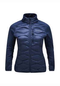 Navyblauwe pufferjack met een hoge kraag, voorzien van een ritssluiting aan de voorkant, een gestructureerd golfpatroon en nauwsluitende mouwen van een soepele stof.