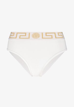 Biale hlačke z visokim pasom, ki imajo okrasen zlat pas z grškim ključnim vzorcem in osrednjim zlatim logotipom. Gladka tekstura.
