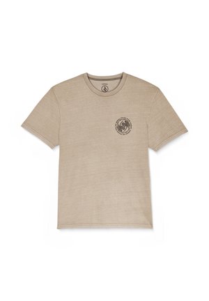 T-shirt in cotone beige con scollo a girocollo classico, maniche corte e un design grafico circolare stampato in marrone scuro sul petto.