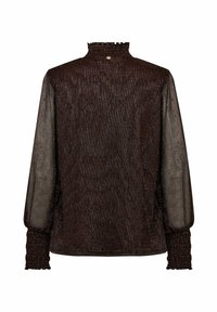 Tamsiai ruda palaidinė su aukštu volanotu apykaklė, surinktomis ilgomis rankovėmis ir prigludusia forma. Priekyje yra mažas auksinis mygtuko užsegimas kaklo srityje.