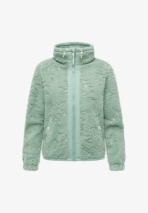 Veste en polaire verte menthe floue avec un col haut, fermeture éclair à l'avant et poches latérales. Tissu texturé avec des accents lisses le long de la fermeture éclair.