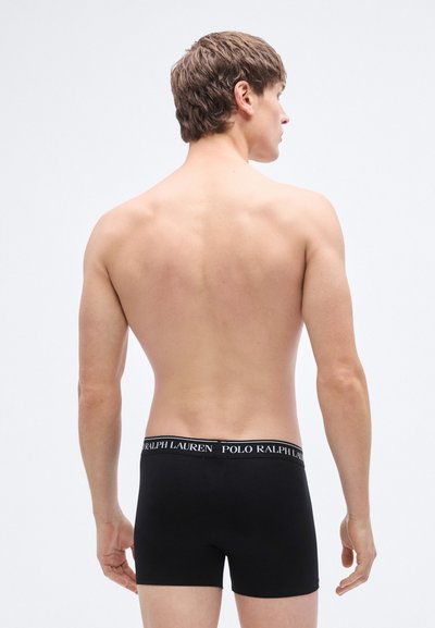Black boxer briefs made of stretchy fabric, featuring a branded elastic waistband with "POLO RALPH LAUREN" in white lettering on black.