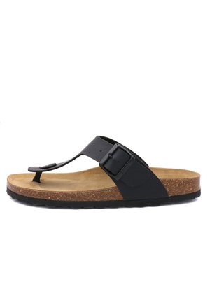 Tongs noires avec une bride texturée et une boucle, un semelle en liège et une semelle en caoutchouc. La partie supérieure est lisse avec une finition mate.