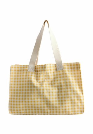 Sac cabas à motif vichy jaune et blanc avec de larges anses en tissu écru sur fond blanc.