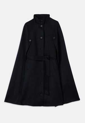 Navy blue wool cape coat with a high collar, seven buttons, and detachable belt. Features a flowing design and smooth texture.