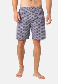 Shorts de bain pour hommes en tissu léger, avec un motif circulaire bleu marine et blanc, une taille élastique avec deux boutons et une coupe ample.