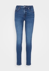 Jeans skinny blu realizzati in denim con una texture liscia. Presentano cinque tasche e accessori metallici. Cuciture visibili lungo le cuciture.