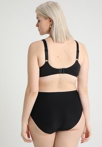 Black bikini set featuring a smooth texture, adjustable straps, and a hook closure. The bottoms are high-waisted for coverage.
