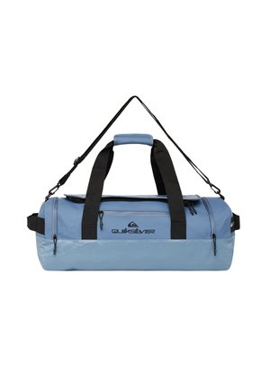 Blue duffel bag with black straps, featuring a rounded shape, zipper pockets, and a logo. Made from durable, glossy material.