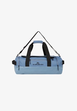Blue duffel bag with black straps, featuring a rounded shape, zipper pockets, and a logo. Made from durable, glossy material.