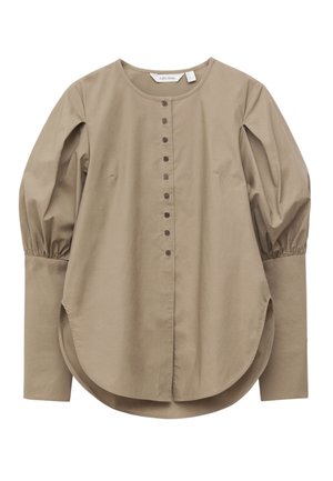 Beige long-sleeve blouse with round neckline, button front, puffed upper sleeves, wide cuffs, and curved hem.