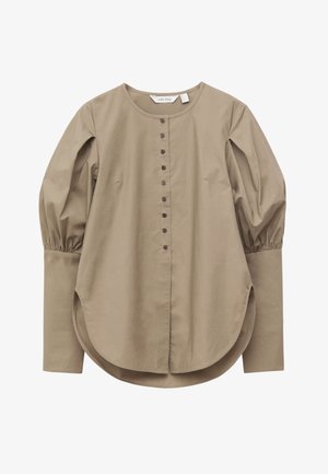 Beige long-sleeve blouse with round neckline, button front, puffed upper sleeves, wide cuffs, and curved hem.