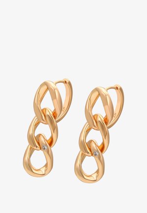 Zlaté náušnice so vzorom prepojených reťazcov a maličkým čírym drahokamom. Hladký, lesklý povrch s zaoblenými hranami.