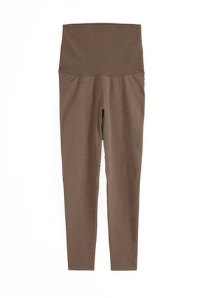 Brune leggings med høj talje og bred elastisk taljebånd, vist fladt mod en hvid baggrund.