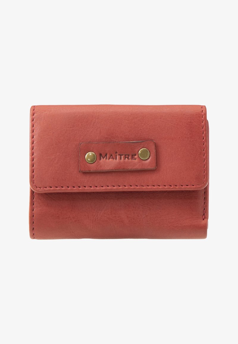 Red leather wallet with fold-over design, featuring a brass snap closure and embossed "MAÎTRE" label on a leather patch. Smooth texture.