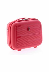Compact red hard-shell suitcase with horizontal ridges, top handle, dual zipper closure, and small feet for standing upright.